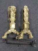 A pair of brass 19th century lion fire dogs.