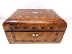 A Victorian burr walnut sewing box with mother of pearl inlay and contents.