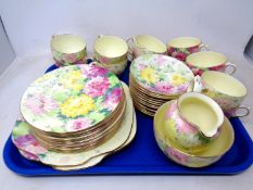 A Crown Staffordshire 40 piece floral pattern tea service.