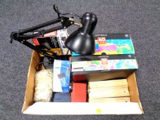 A box containing an angle poise lamp, two boxes of acrylic paints, office equipment etc.