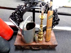 A galvanized watering can, continental brass table lamp, cricket bat,