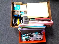 Two boxes containing stationery items including paper, razors, paper clips, mailing bags,