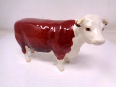 A Beswick Hereford Cow no. 1360, brown and white gloss.