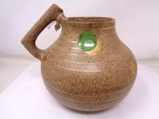 A Clarice Cliff Bizarre Newport Pottery Goldstone pattern jug (height 18cm).