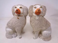 A pair of 19th century crackle glaze Staffordshire dogs.