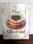 A reproduction French chocolate sign.