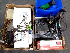 Two boxes containing assorted remotes, traffic assist satnav, electric microscope,