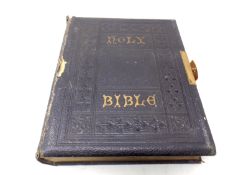 An antique leather bound Holy Bible.