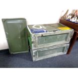 Two military metal storage crates with spare lids.