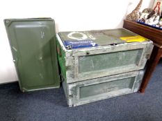 Two military metal storage crates with spare lids.
