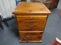 An Australian plantation pine two drawer filing cabinet, with key.