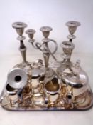 A four piece S Heart & Co plated tea service on tray together with a pair of plated candlesticks