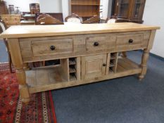 A rustic farmhouse pine kitchen unit fitted with drawers,