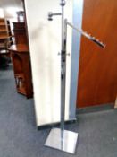 A chrome metal adjustable clothes rail.
