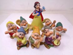 A set of eight Schmid bisque porcelain Snow White and the Seven Dwarves Disney figures (tallest