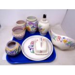 A tray of eight pieces of Poole pottery including a lamp base, butter dish, vases etc.