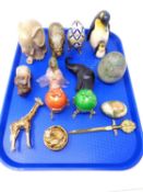 A tray containing assorted ornaments, metal enamelled giraffe, lettered pillbox, enamelled eggs,