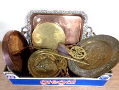 A box containing antique and later metal wares including a plated serving tray, brass wall plaques,