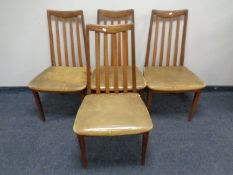 A set of four 20th century teak G plan rail back chairs.