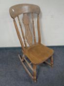 A 19th century pine rocking chair.