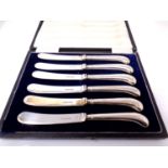 A boxed set of six silver handled butter knives, Sheffield marks.