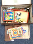 A vintage case containing assorted games including Walt Disney Tiddly Winks.