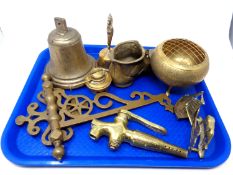 A tray containing antique and later brass ware including a bell, wall bracket, spirit kettle burner,