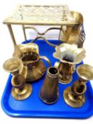 A tray containing antique and later brass ware including a trivet, jug, a pair of vases etc.