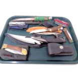 A tray of folding pocket knives, a Swiss Army knife, antler handled knives etc.