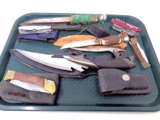 A tray of folding pocket knives, a Swiss Army knife, antler handled knives etc.