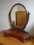 A Victorian mahogany toilet mirror.