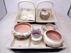 A tray of nine pieces of Poole pottery.
