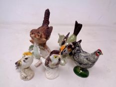 A group of four Goebel china bird ornaments (tallest 12cm).