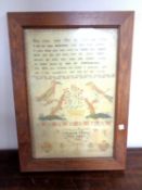 A pine framed print of a Georgian sampler