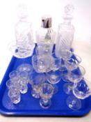 A tray containing assorted cut glass including a pair of decanters, claret jug,