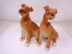 A pair of USSR china dog figures (height 17cm).