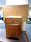 A pine bedside cabinet with a fitted drawer together with two 3' bergere headboards.
