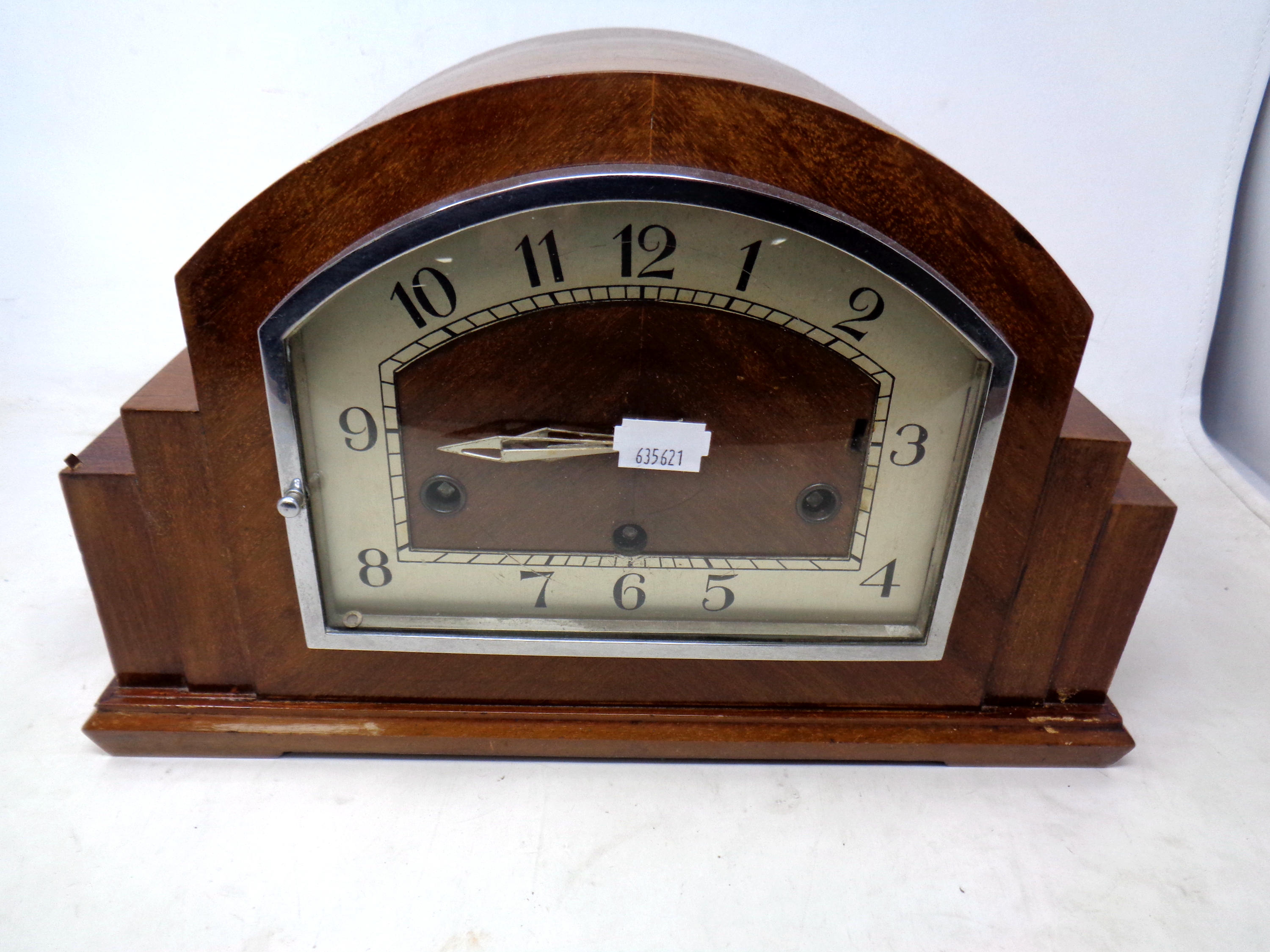 An Art Deco walnut cased mantel clock.
