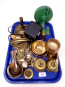A tray containing metalware including a brass wall bracket, candlestick, napkin rings,