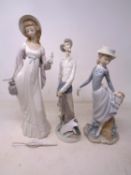 Three Lladro figures, Don Quixote together with two further figures of ladies.