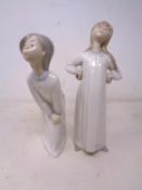 Two Lladro figures of girls in night dress.