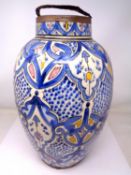 A faience terracotta vase (height 39cm).