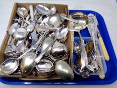 A tray containing a large quantity of plated table cutlery, ladles, servers, crested teaspoons.