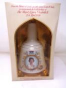 A Bell's scotch whisky decanter commemorating the 60th birthday of Queen Elizabeth II (1986).