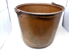 An 19th century copper cooking pot with cast iron handle (diameter 39cm).