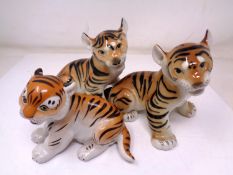 A set of three USSR china tiger figures (tallest 12.5cm).