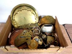 A box containing antique and later copper and brass ware including trays, chestnut roasters,