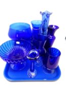 A tray of blue glassware including an oversized goblet, pedestal bowl, mottled glass vase etc.
