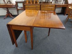 A 19th century mahogany flap sided dining table.