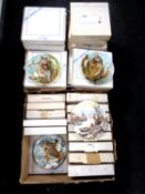 Two boxes containing a large quantity of Coalport collectors plates.